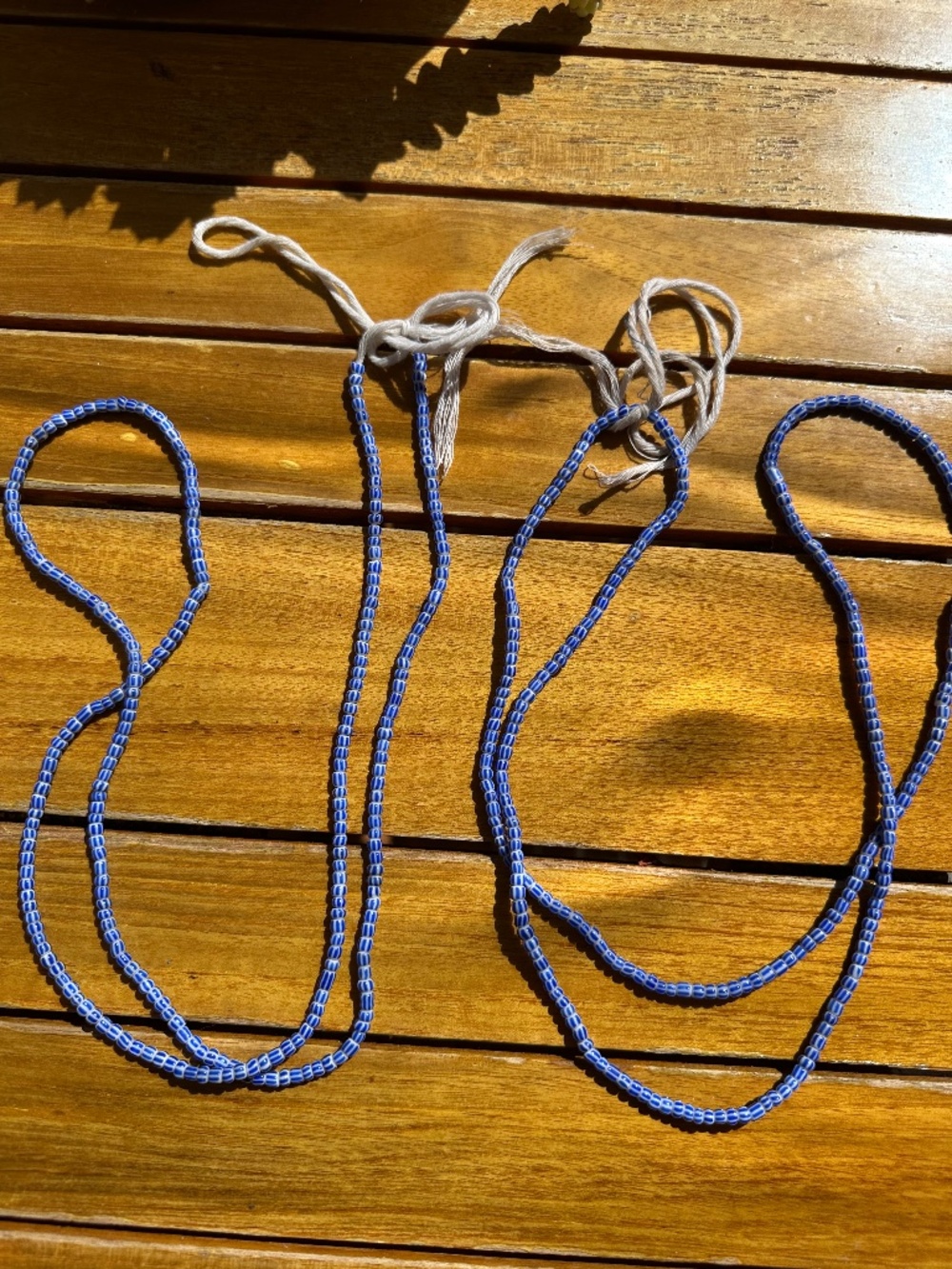 Beautiful set of two long blue-and-white striped glass bead necklaces